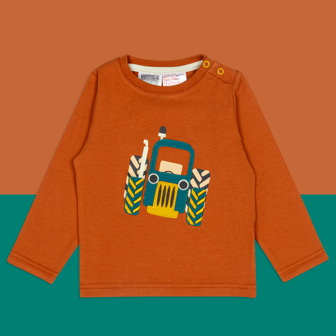 Children's orange long slevve T-shirt with tractor design on a dark orange
background